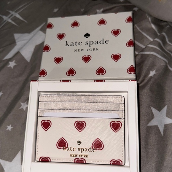 kate spade Handbags - NWT and box Kate spade red hearts ❤️ card holder holds six cards nice 😊